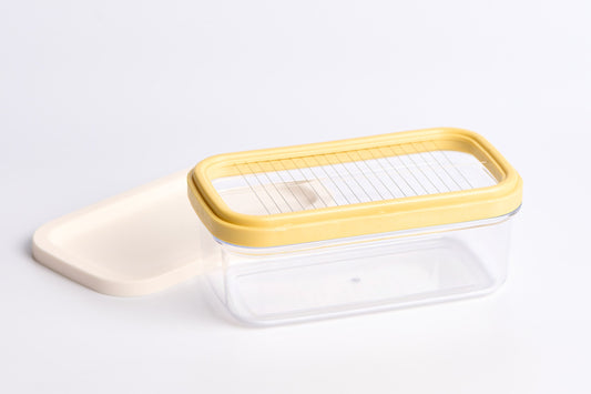 Plastic butter dish with silicone lid and slicer